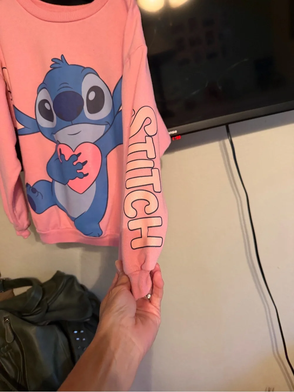 Disney Pink Crewneck Sweatshirt with Blue Stitch Holding Heart
